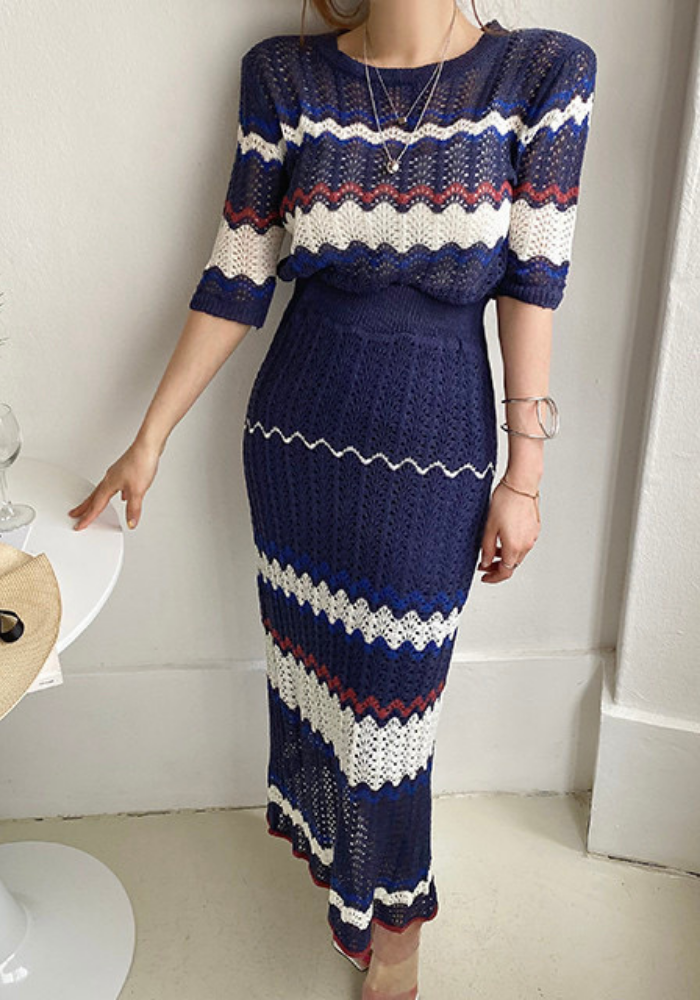 Knitted hollow contrasting top + hip-covering skirt set