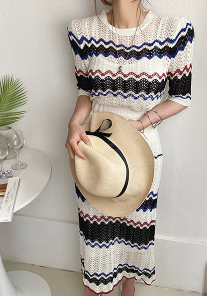 Knitted hollow contrasting top + hip-covering skirt set