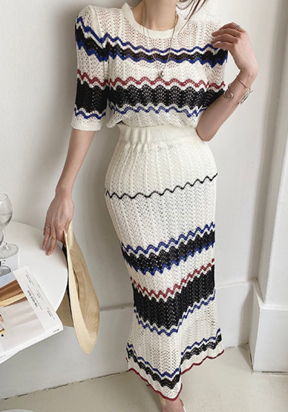 Knitted hollow contrasting top + hip-covering skirt set