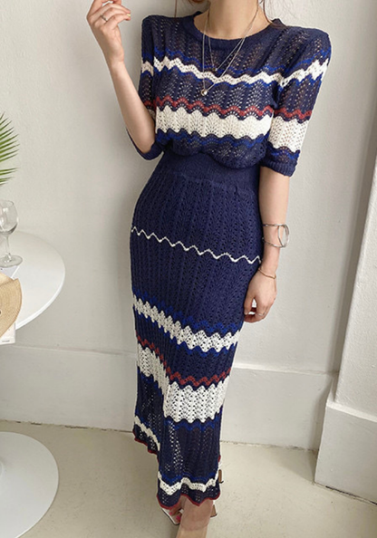 Knitted hollow contrasting top + hip-covering skirt set