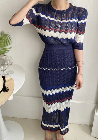 Knitted hollow contrasting top + hip-covering skirt set