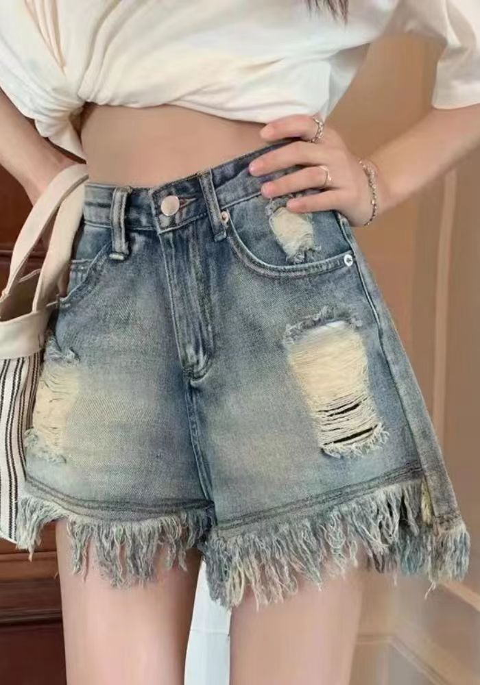 Distressed fringed wide-leg shorts